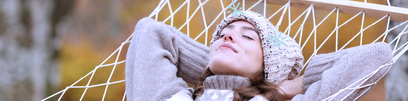 A person relaxing in a hammock